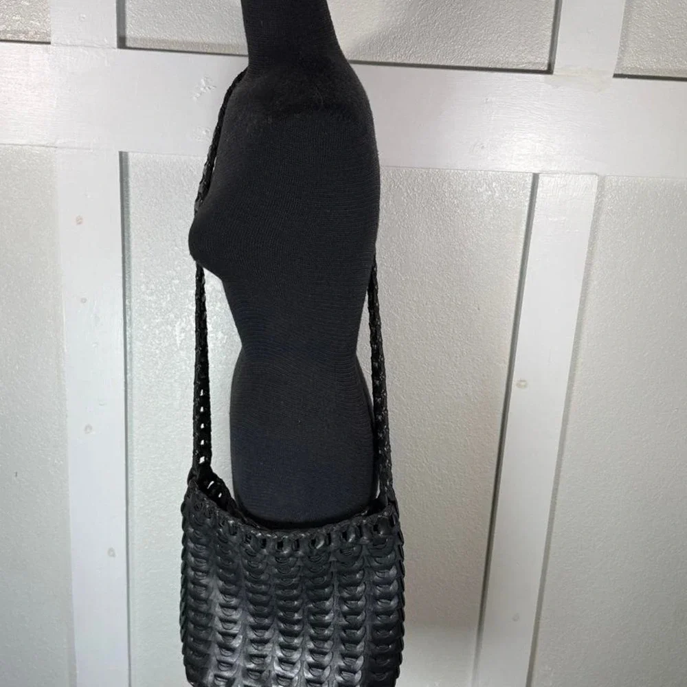 Black woven leather shoulder bag with strap